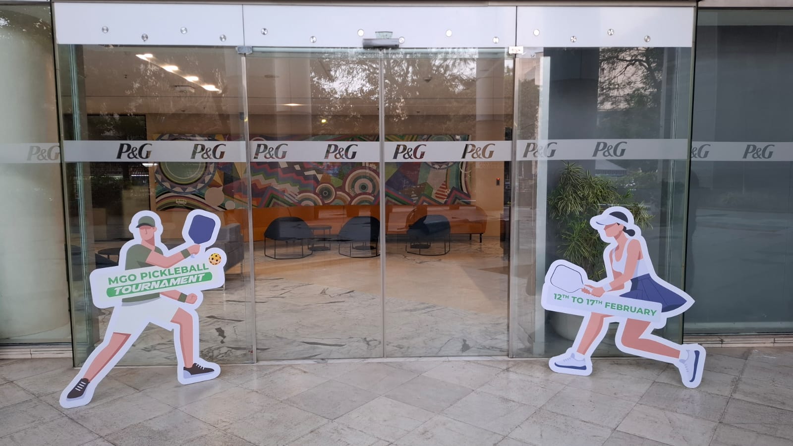 P&G Pickleball illustrated player cut-outs installed at the entrance