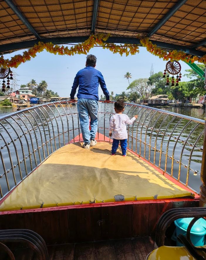 Father and child walking together on a colourful bridge